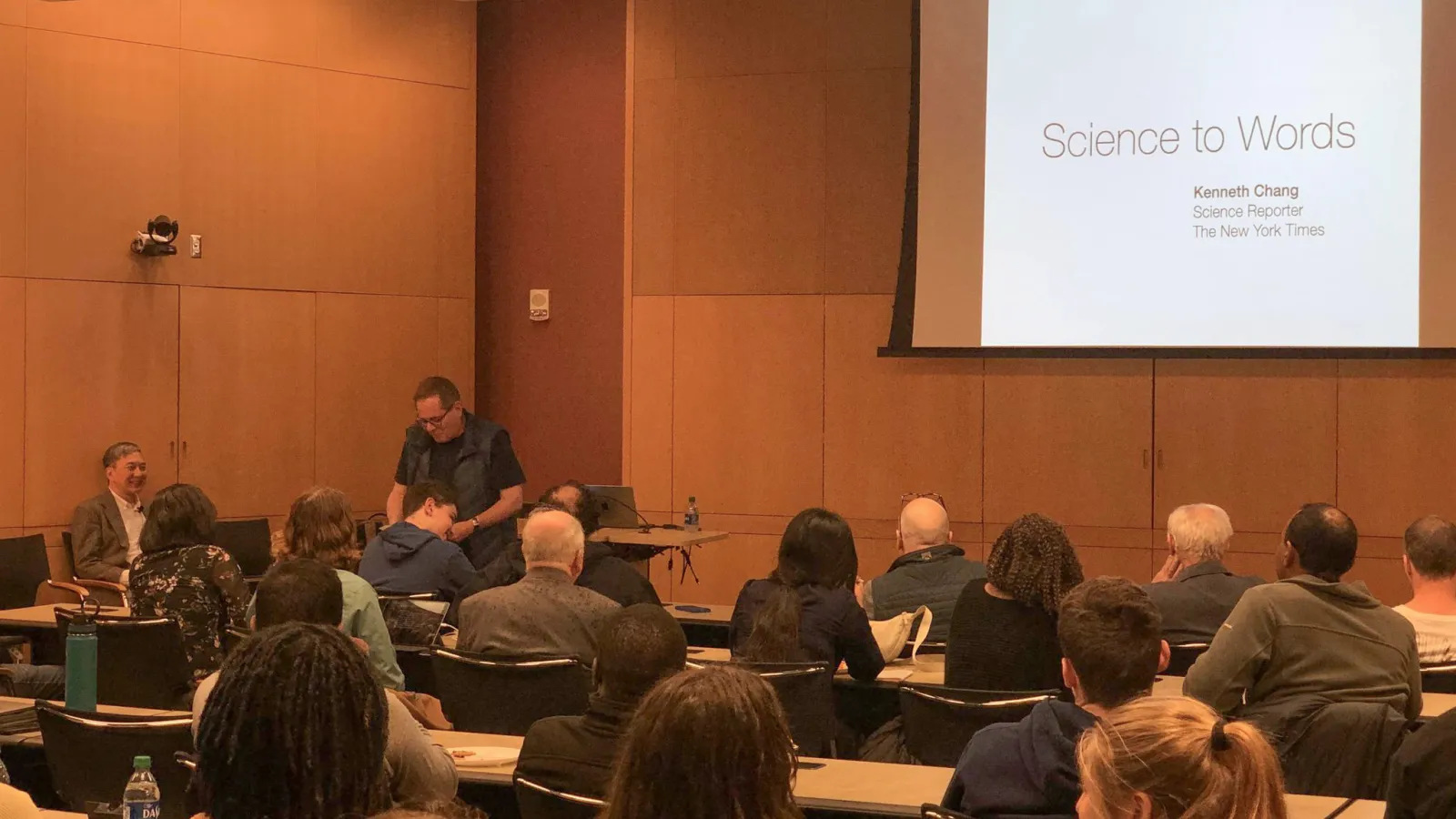 Prof. Lou DiMauro introduces Kenneth Chang to audience before lecture.